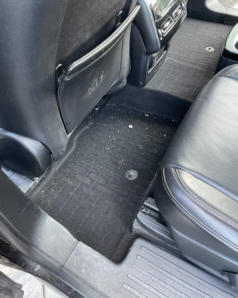Same rear seat and carpet before detailing
