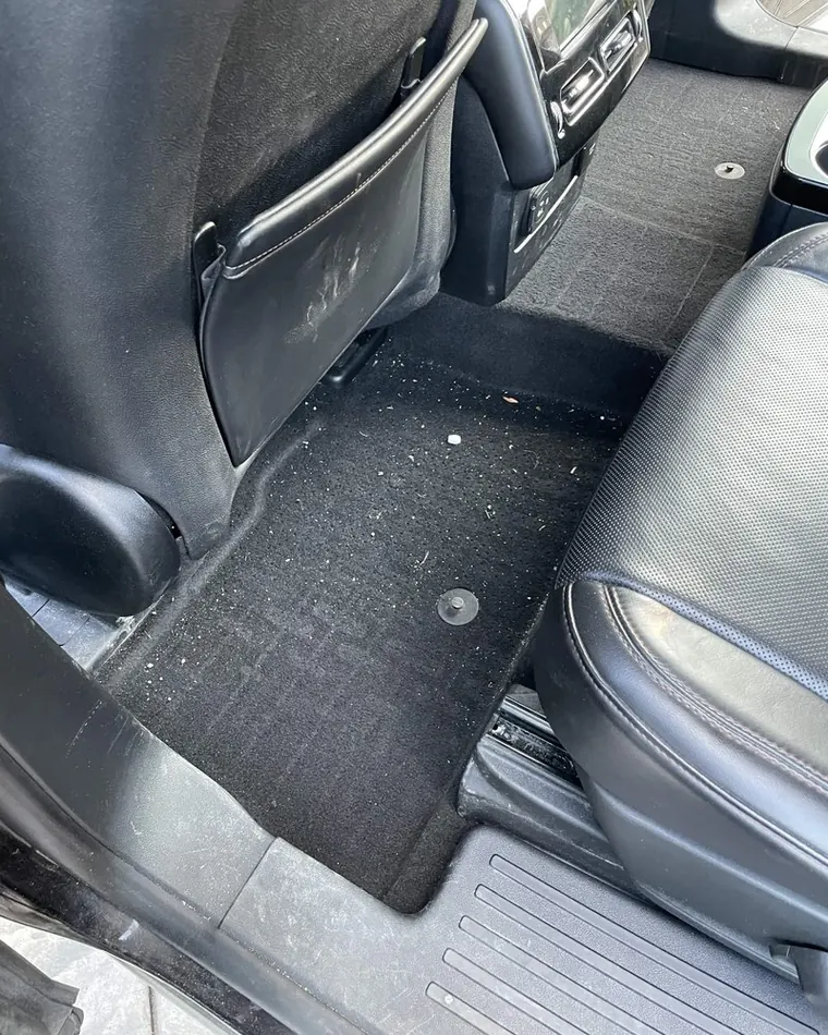 Same rear seat and carpet before detailing