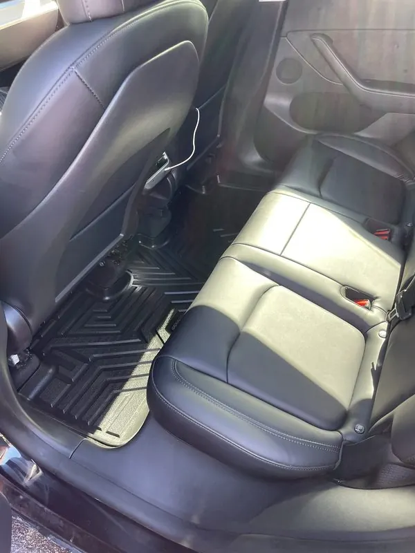 Rear seats cleaned and conditioned with fresh mats